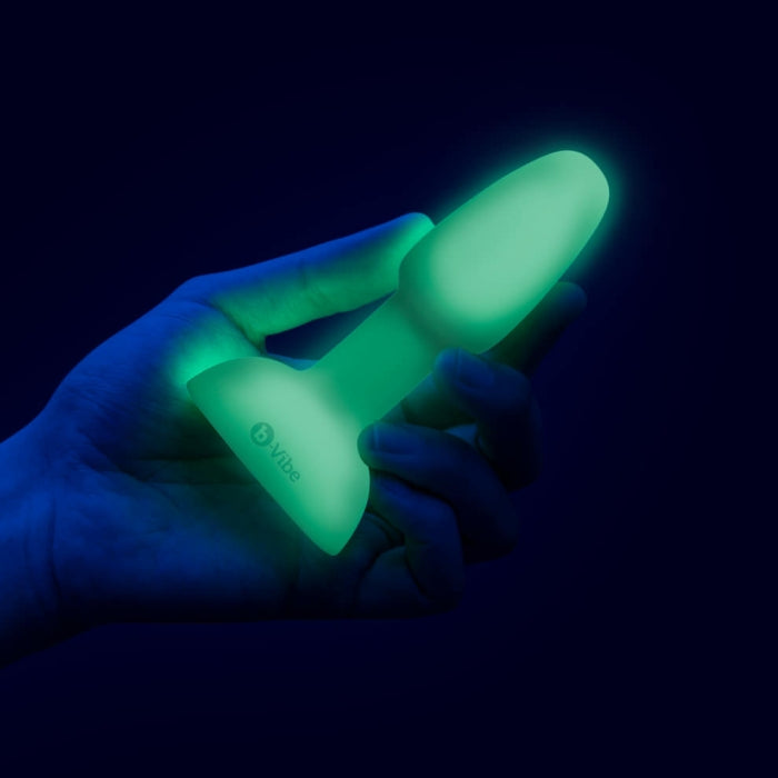 A hand holds the Petite Rimming Plug. It looks slender within the hand at about the width of two fingers. | Kinkly Shop