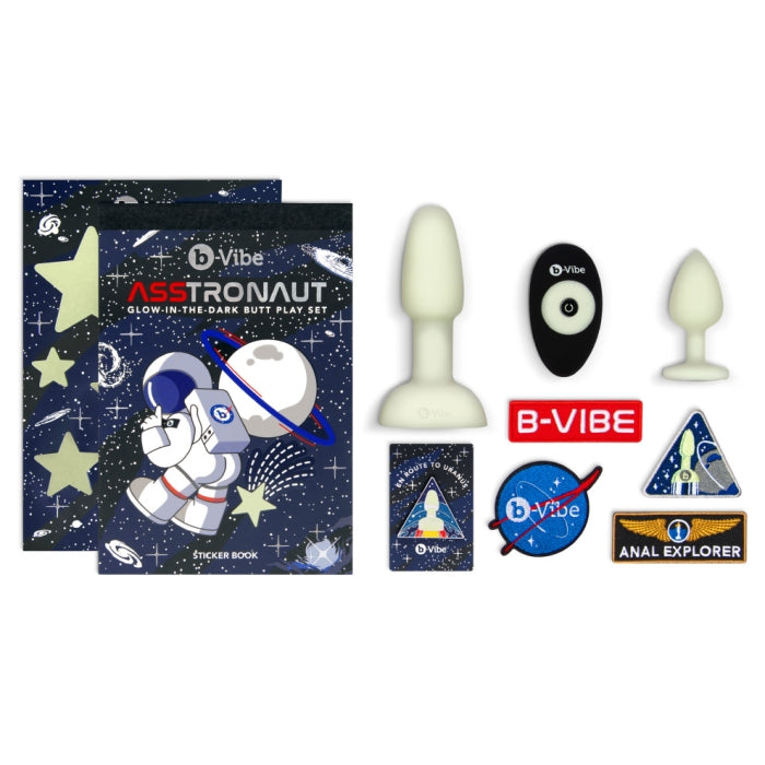 Everything included in the B-Vibe ASStronaut Set. It includes two silicone plugs, a remote control, four patches, an enamel pin, glow in the dark stores, a bag, and more. | Kinkly Shop