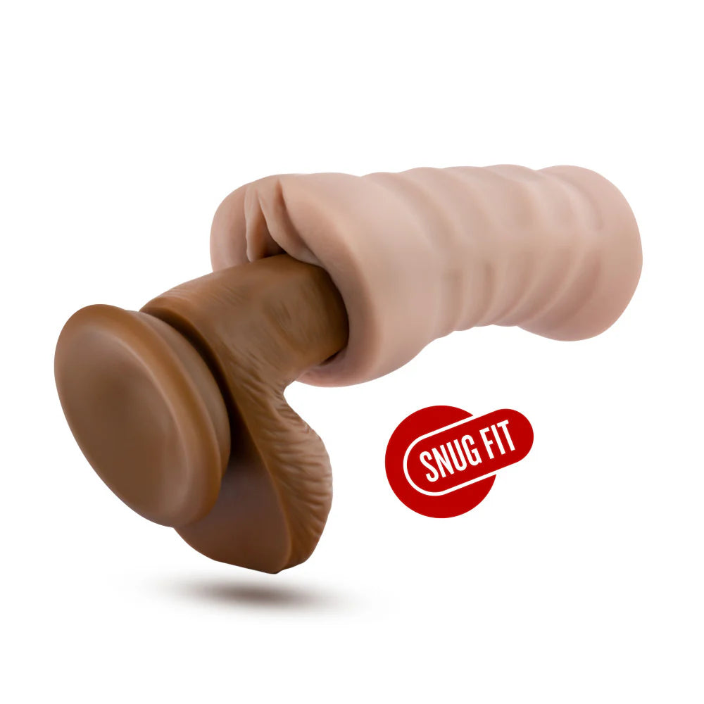 The Blush Rain with Vibrator shown with a realistic dildo slid inside of the stroker. It looks tight. | Kinkly Shop