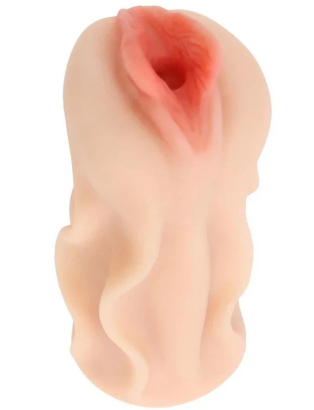 View from the side of the Asa Akira Pussy. There are swirly textures along the stroker to help make it easier to grip.