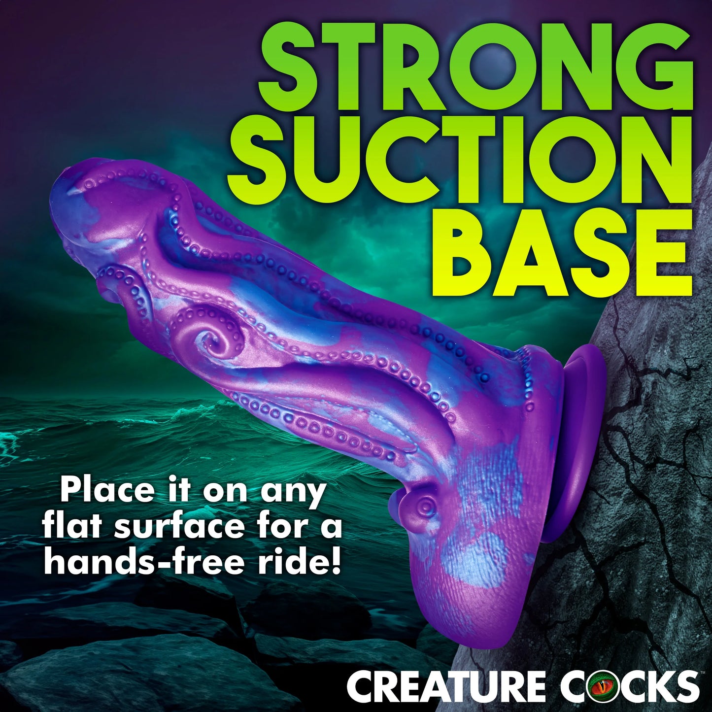 The Creature Cocks Octophallus shown photoshopped suction cupped onto a tree. (That would not work in real life) Text on the image reads: "Strong suction base. Place it on any flat surface for a hands-free ride!" | Kinkly Shop