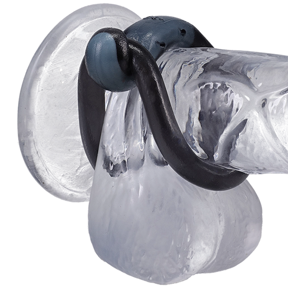 The FIRMTECH Max shown wrapped around the base of a clear realistic dildo. | Kinkly