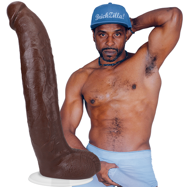 A shirtless Brickzilla staring sexually at the camera. The Signature Cocks - Brickzilla dildo is shown next to the shirtless model. | Kinkly Shop
