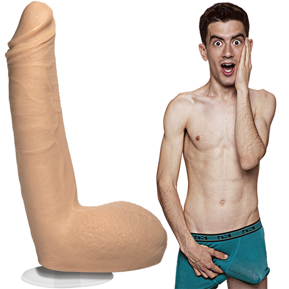 A shirtless Jordi El Nina Polla is wearing his boxer briefs with an erection. The Signature Cocks - Jordi El Nina Polla dildo is sitting out next to him, showcasing the lifecast dildo. | Kinkly Shop