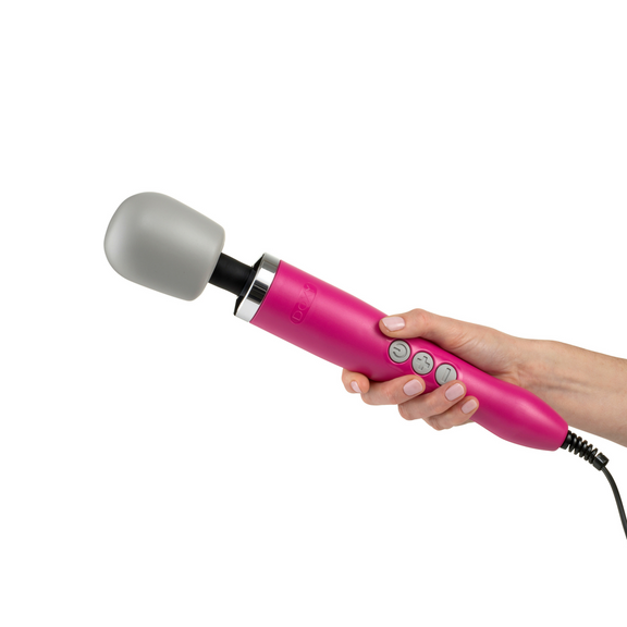 A hand holds the Doxy Original Massager. It looks like a long, full-length wand massager. | Kinkly Shop