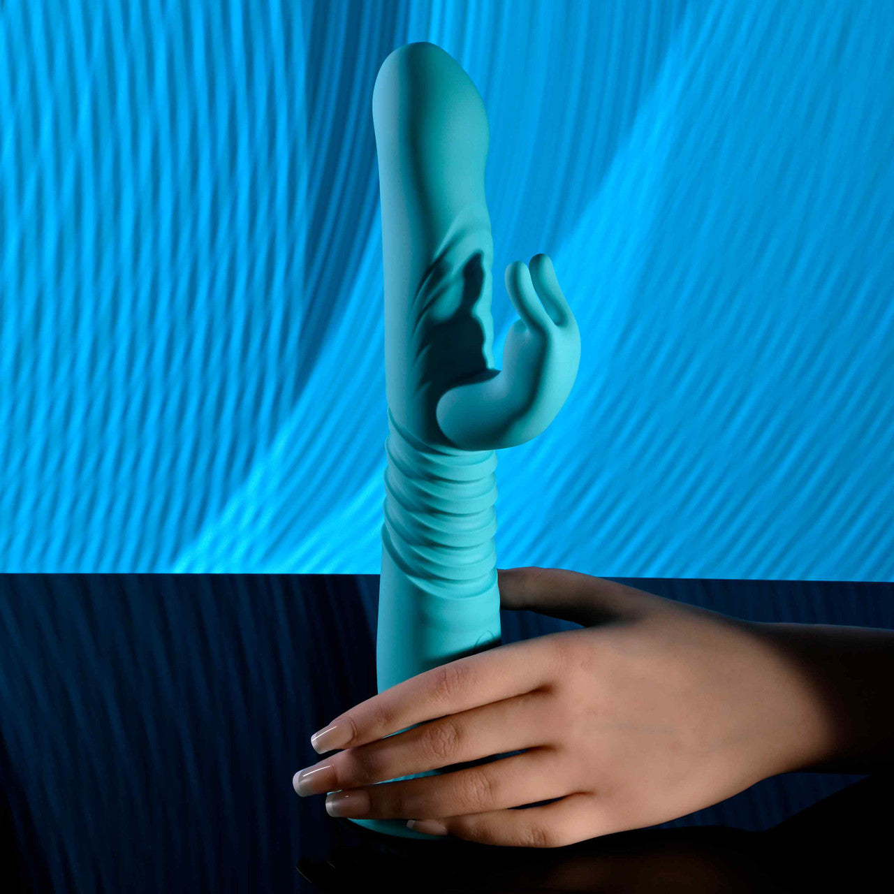 Fingers wrap around the base of the Evolved Bunny Hop. | Kinkly