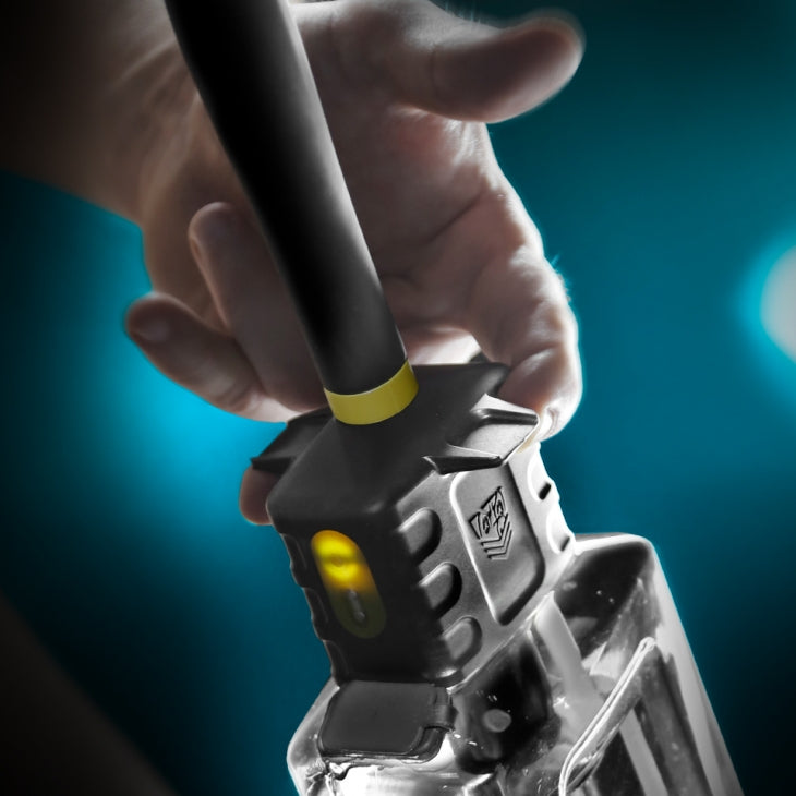 A person's fingers wrapped around the bottle of the Fort Troff Hydro-Pro Automatic Cleaning System | Kinkly Shop