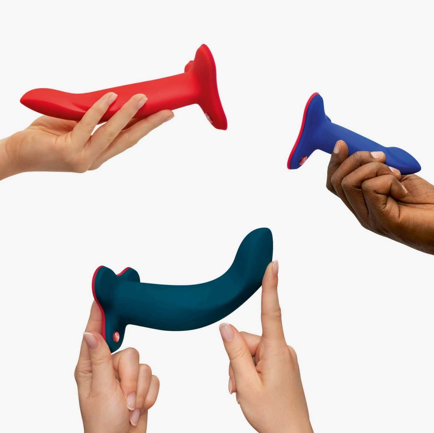 Four hands hold up the different sizes of the Fun Factory Limba Flex, showcasing how they all look next to one another. The small is the shortest while the Medium and Large look to be about the same length. The Small and Medium look like they have similar diameters while the Large looks noticeably thicker than the other two. | Kinkly Shop