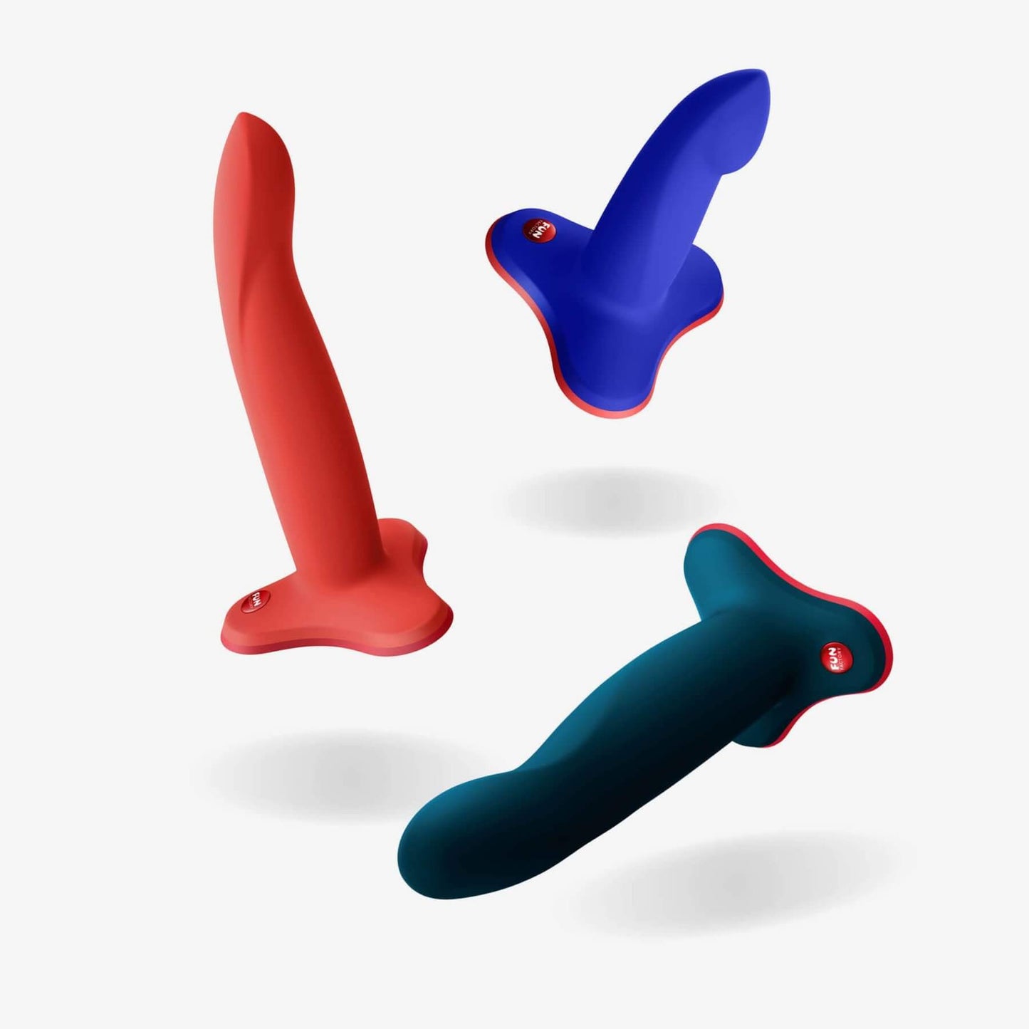 All three Fun Factory Limba Flex sizes next to one another, scattered across a white background image. | Kinkly Shop