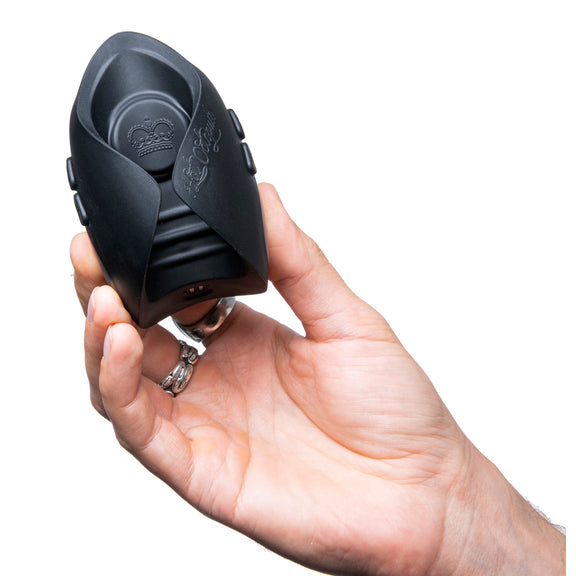 A hand holds the Hot Octopuss Pulse Solo Interactive vibrator. It looks like it would fit really comfortably between the fingers. | Kinkly Shop