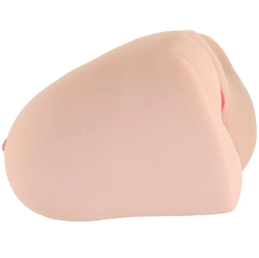 Side view of the Keisha Grey Titwoman: Double Sided Masturbator. This showcases how the breasts are on one side with the vulva on the opposite side. | Kinkly Shop