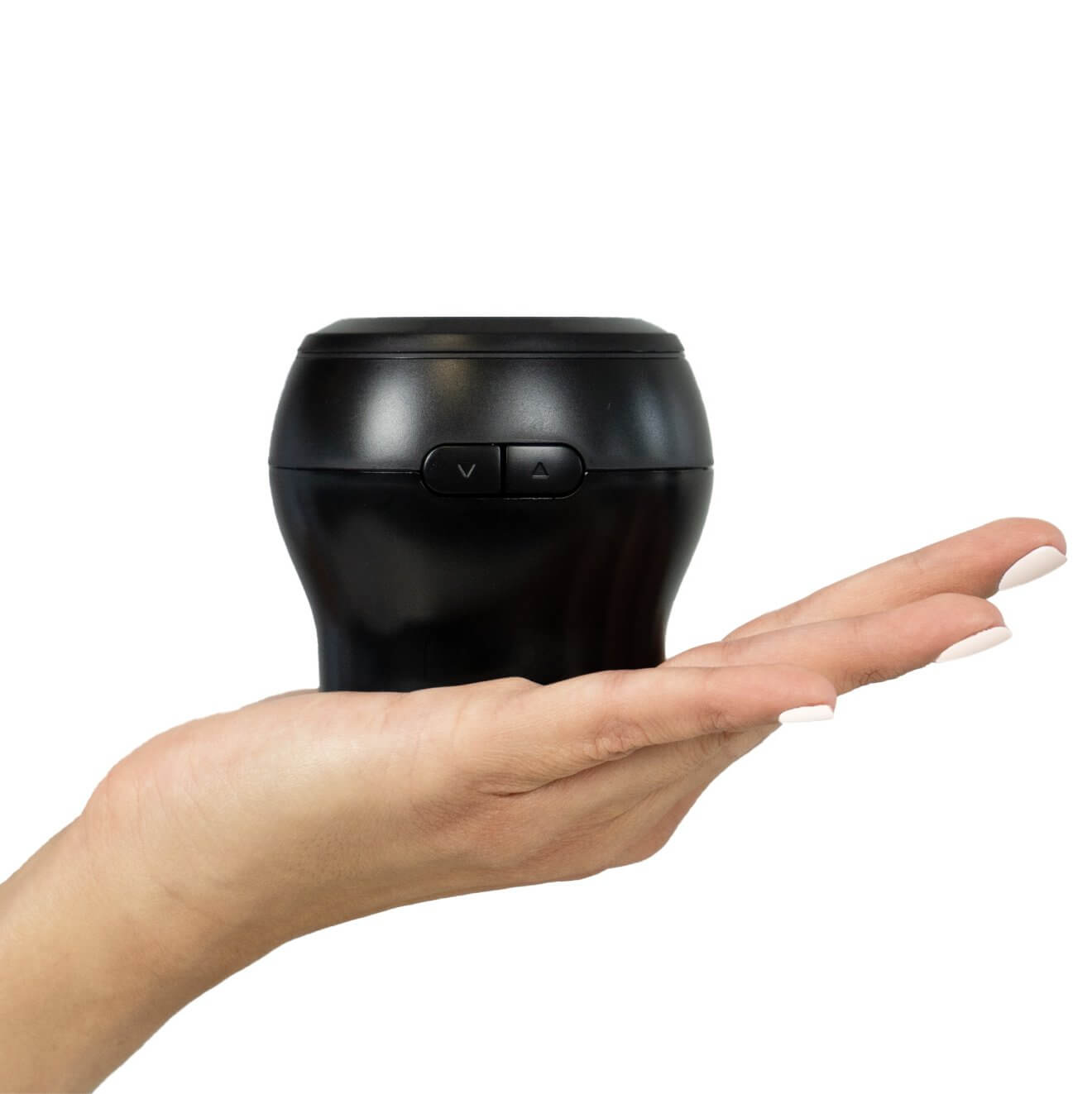 A flat hand has with the KIIROO Power Blow on top of it. It looks like the Power Blow attachment would fit comfortably into the palm of the hand. | Kinkly Shop