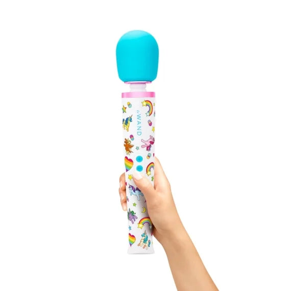 A hand holds the Le Wand Unicorn Wand Set. The wand is a full-sized wand and much larger than the person's hand that's holding it. | Kinkly Shop
