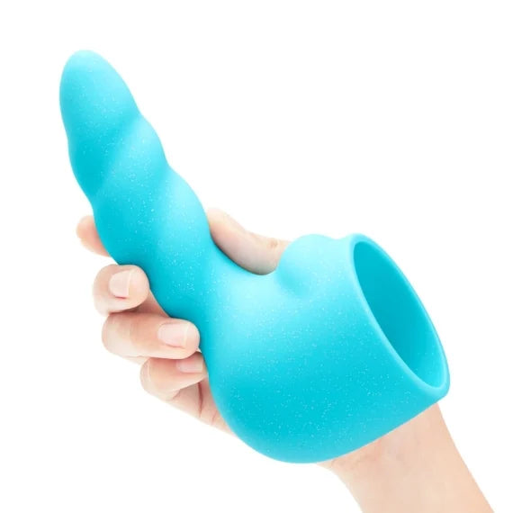 A person is holding the Le Wand Unicorn Wand Set attachment in their hand. The insertable shaft is lightly twisted like a unicorn horn. | Kinkly Shop