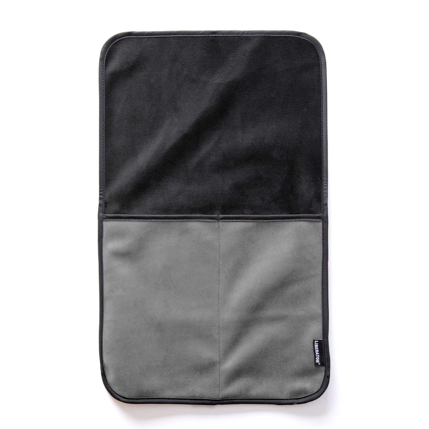 The Liberator Fascinator Sex Toy Caddy in Grey laying flat on a white surface. There are two deep pockets sewn into the base of the Caddy with a long, flat surface on top that can be tucked underneath any heavy objects. | Kinkly Shop