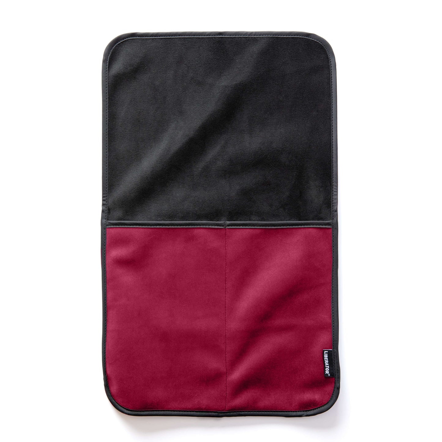 The Liberator Fascinator Sex Toy Caddy in Merlot laying flat on a white surface. There are two deep pockets sewn into the base of the Caddy with a long, flat surface on top that can be tucked underneath any heavy objects. | Kinkly Shop