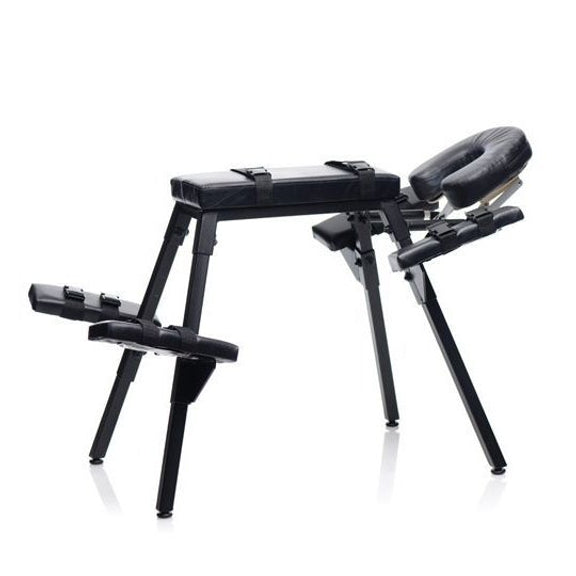 The Master Series Obedience Extreme Sex Bench in front of a white background. All of the fastening straps are fastened tightly and resting snugly against their padded surfaces. | Kinkly Shop