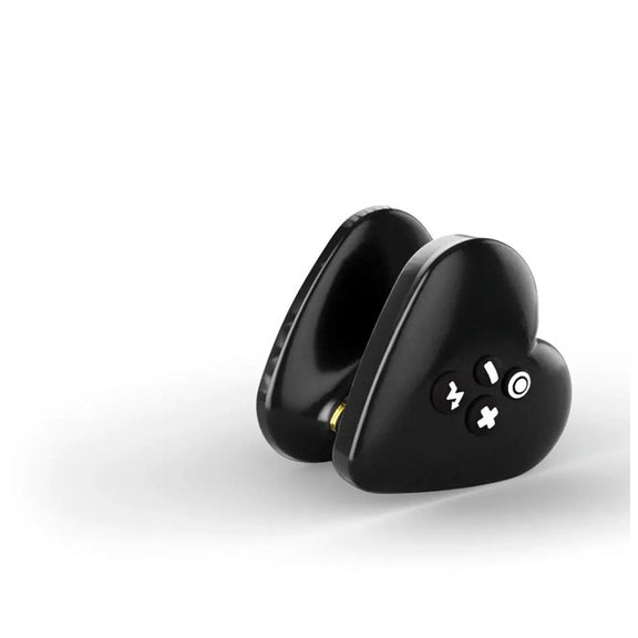 The Mystim Heart's Desire at an angle, showcasing its heart-shaped design, the four-buttons on one side, and the unique internal plastic thin diameter that makes it easy to grip. | Kinkly Shop