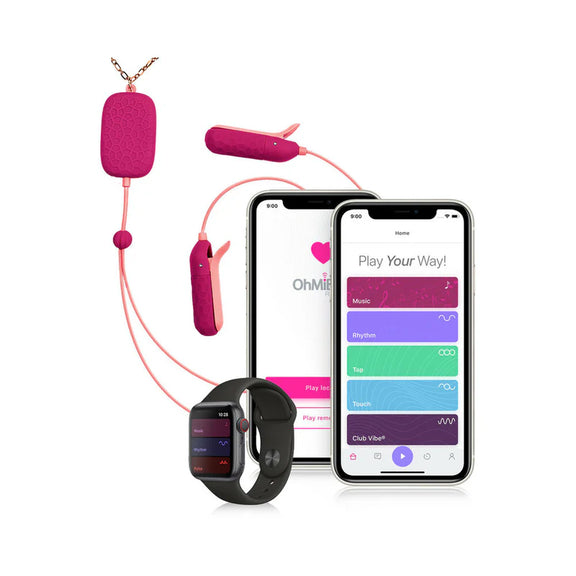 The OhMiBod Sphinx shown next to a cell phone and smartwatch that have the OhMiBod app pulled up, showcasing the wireless control possible by the app. | Kinkly