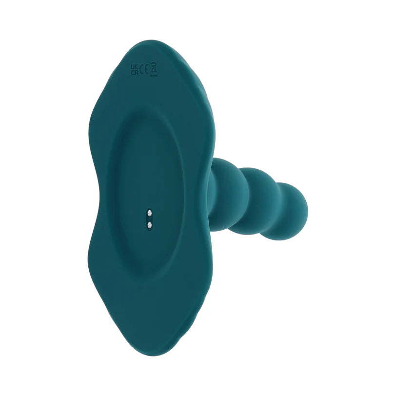 Close-up on the base of the Playboy Have A Seat. The magnetic charging port is located underneath the toy. | Kinkly