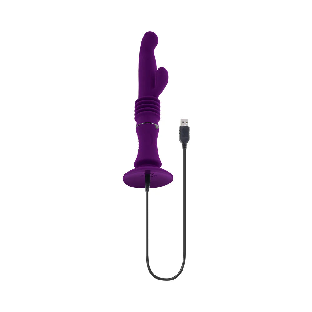 The Playboy Hoppy Ending with the charging cable plugged into it. The charging port is underneath the base. | Kinkly Shop