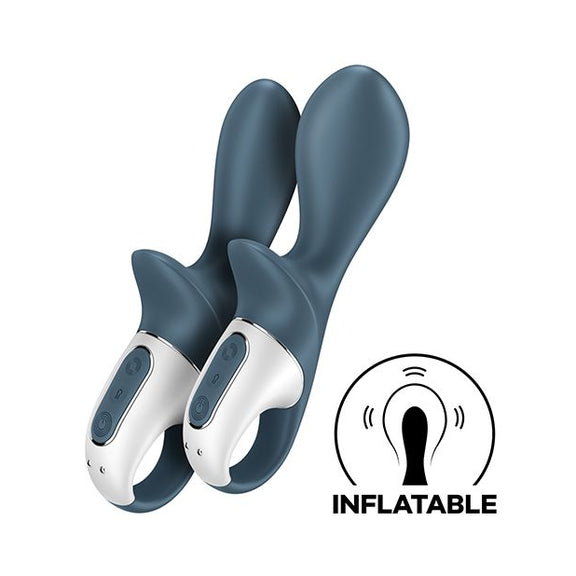 Two of the Satisfyer Air Pump Booty 2 toys sitting next to one another. The toy on the left is fully deflated, looking slimmer in thickness. The toy on the right is fully inflated, looking much thicker than the full deflated version. An illustrated icon in the lower right corner says "Inflatable" and shows the thickening design of the tip. | Kinkly Shop