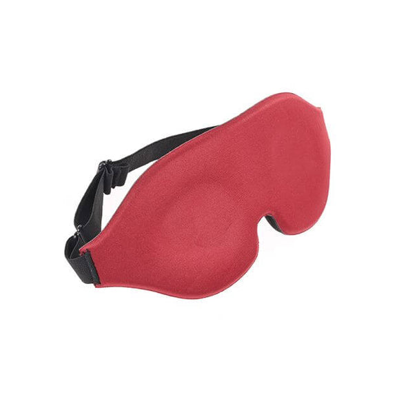 A 3/4ths view of the Sportsheets Saffron Blackout Blindfold. This image showcases the elastic band that wraps around the head, including its adjustable slider buckle that allows for complete control of the tightness of the blindfold. | Kinkly Shop