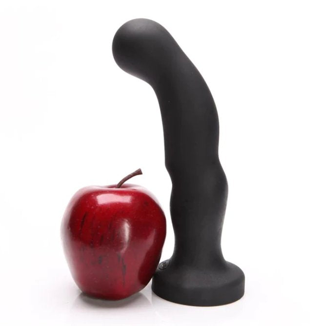 The Tantus P-Spot dildo next to a red apple. It's about 2.5 times longer than the dildo, and it's about 1/4th the width of the apple's width. | Kinkly Shop