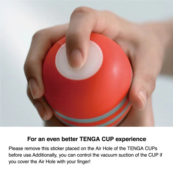 A hand covers the hole on the end of the Tenga Original Vacuum Cup. Text reads: Please remove the sticker on the air hole of the Tenga cup before use. Control the vacuum suction of the Cup by covering the air hole. | Kinkly Shop