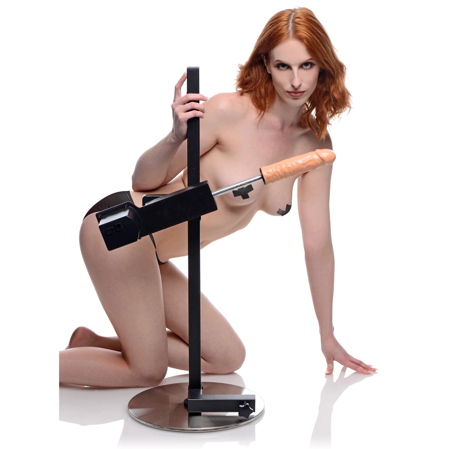 A person is kneeling next to the Dicktator Extreme Sex Machine, showcasing the size of the sex machine. It's much, much taller than your average sex machine, allowing you to use it while on top of the furniture you already own. | Kinkly Shop