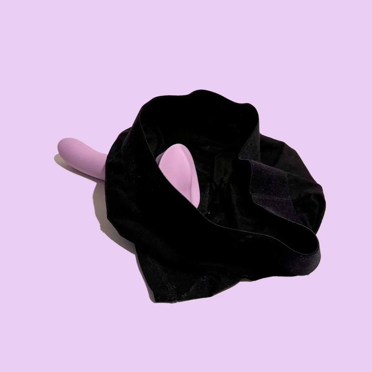 The Wet for Her Fusion 2.0 with Grinding Base shown in a harness. The protruding, grinding base is shown protruding towards where the wearer would strap it on. | Kinkly Shop