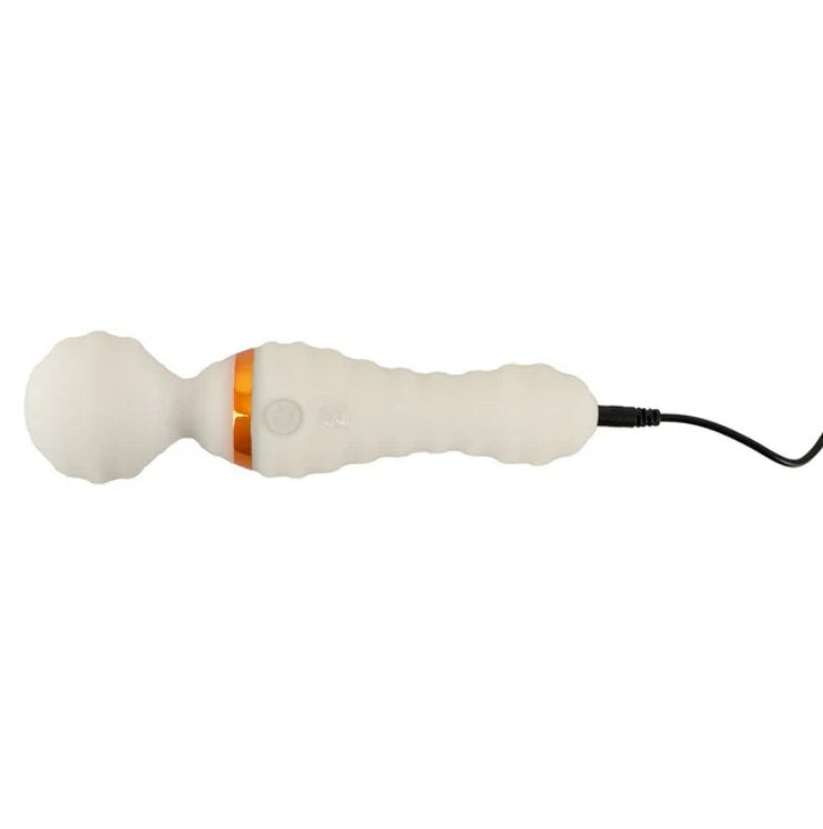 The You2Toys Glow-in-the-Dark Wand Vibrator plugged into its charger. The charging cable plugs in at the base. | Kinkly Shop