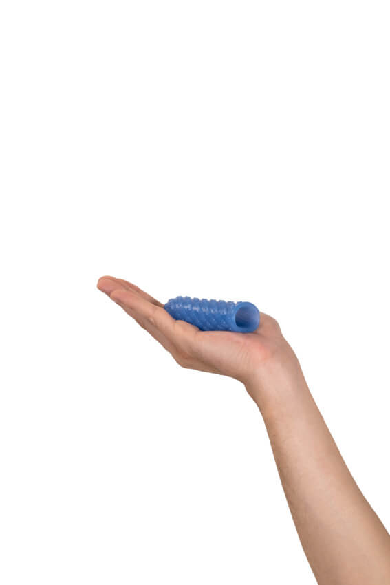 A flat palm against a white background. The Arcwave Ghost is resting on top of the outstretched palm. It is slightly longer than the person's palm, and it looks like it would slide nicely onto a finger. | Kinkly Shop