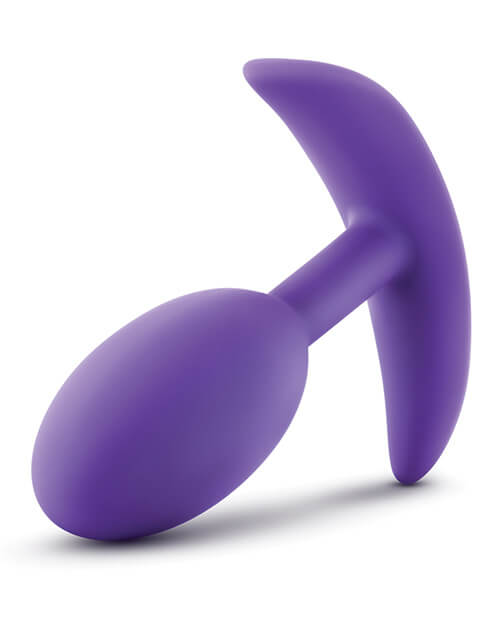 An angled image shows the rounded tip of the Blush Luxe Vibra Slim plug with the long, expansive base at its bottom. | Kinkly Shop