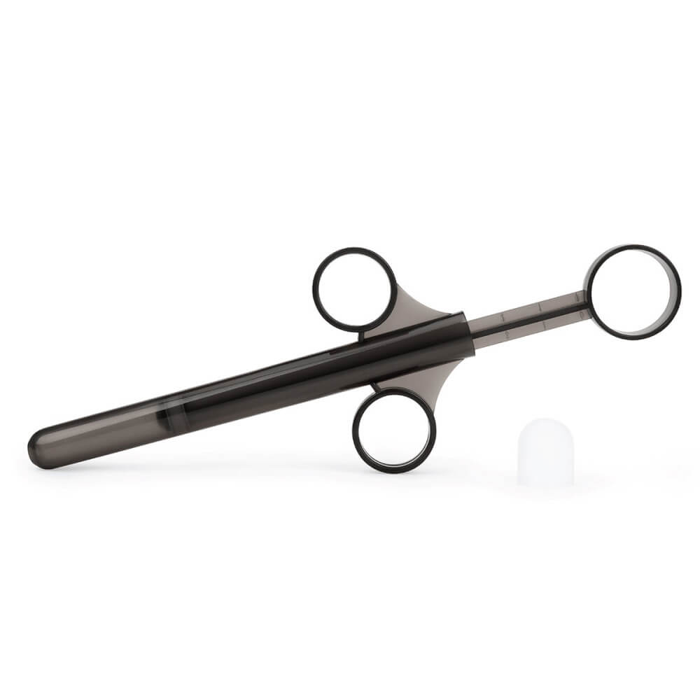 A close-up of the included, plastic lube shooter in the b-Vibe mASSter's Degree Anal Set. It looks like a regular lube shooter and doesn't look extra-large. | Kinkly Shop