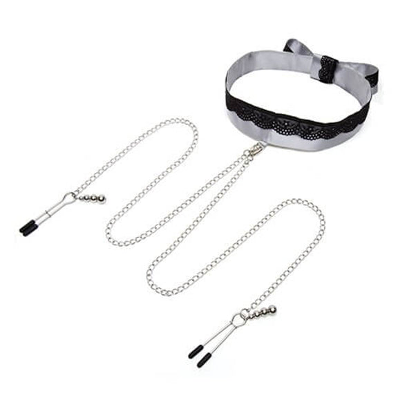 The "Play Nice" Satin Collar with Nipple Clamps laid out against a white background. The collar is fastened and propped up while the chains for the nipple clamps protrude from the collar itself. One nipple clamp is fastened shut and the other nipple clamp is open. | Kinkly SHop