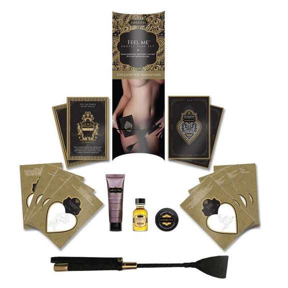 Everything included in the Kama Sutra Feel Me Kit laid out against a white background. It includes all of the cards, the packaging, the sensual products, and the riding crop. | Kinkly Shop