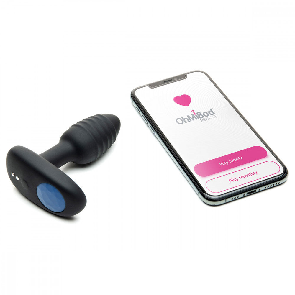 OhMiBod Lumen sitting next to a cell phone that has the OhMiBod Remote app pulled up on it | Kinkly Shop