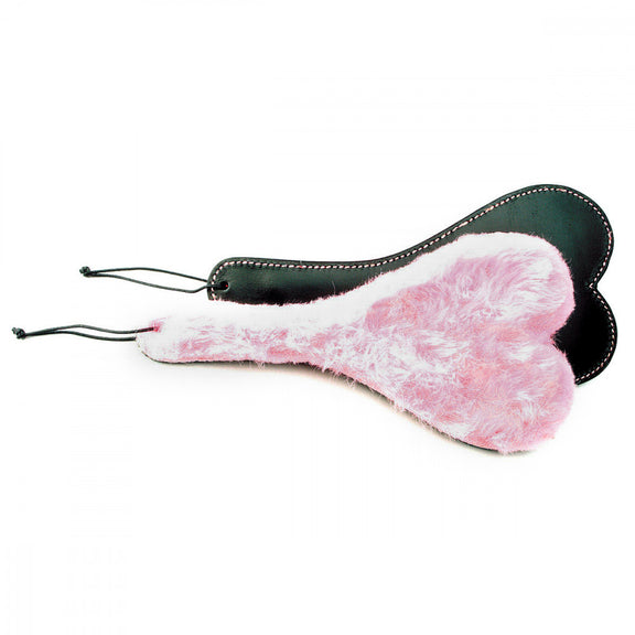 Two Ruff Doggie Styles Double-Sided Heart Paddle beginner paddles are shown to show each side of the paddle including the flat, leather side and the faux fur side. Both sides show off the heart-shaped design | Kinkly Shop