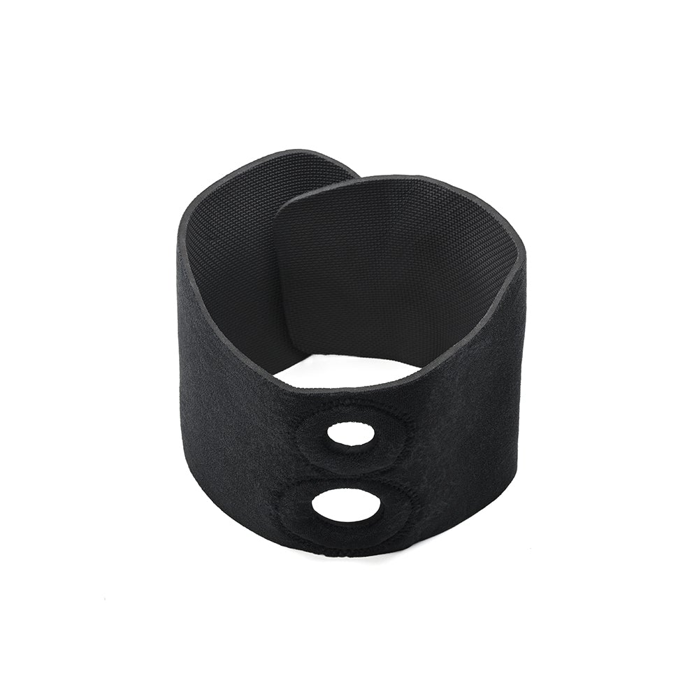 The Sportsheets Dual Penetration Thigh Strap-On Harness fastened onto itself in a circular fashion against a plain white background. This view showcases the design of the Hook and Loop fastener design while also showcasing the two built-in O-ring holes. The two holes are clearly different diameters. | Kinkly Shop