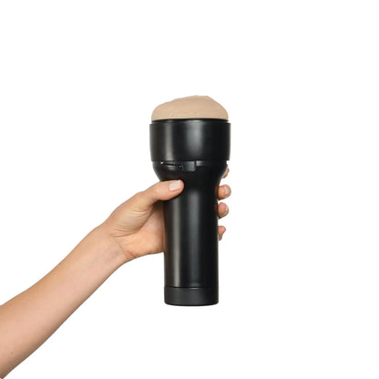 A hand holds the KIIROO FeelStars FeelNicolette Stroker | Kinkly Shop