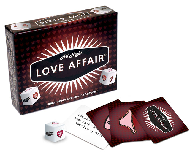The Love Affair game box with some of the cards and a dice laying in front of the box to showcase what the game pieces look like. | Kinkly Shop