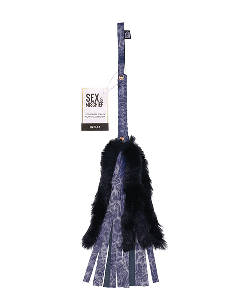 Packaging of the Sportsheets Cougar Faux Fur Flogger. It includes a small cardboard tag on the wrist strap. | Kinkly Shop