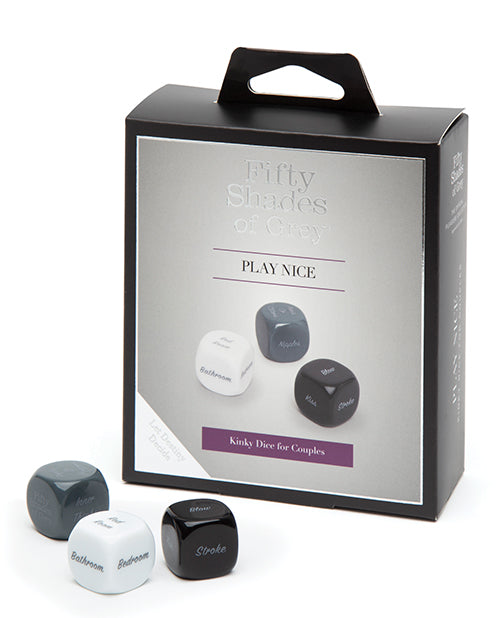 The Fifty Shades of Grey Kinky Dice sitting out in front of the packaging that they come in. | Kinkly Shop