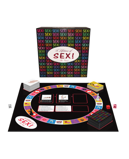 The A Lifetime of SEX! board game and its set up shown in front of the cardboard box packaging it comes in | Kinkly Shop