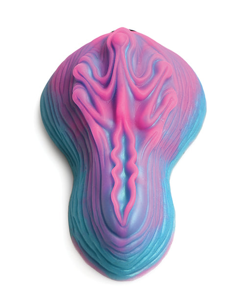 Top-down view of the Creature Cocks Vulvaron Remote-Control Vibrating Grinder. The Grinder has a very interesting texture throughout the sides and the top of the toy. | Kinkly Shop
