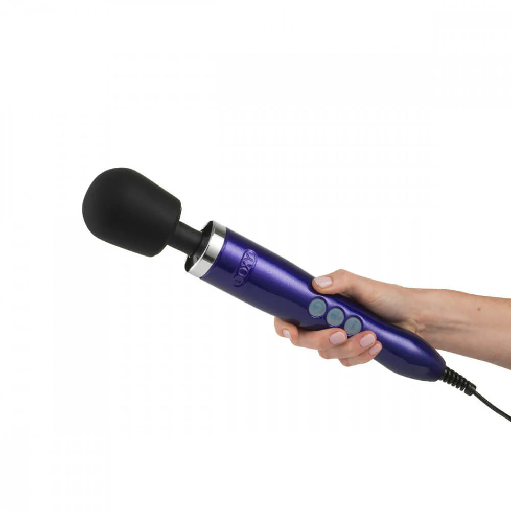 A hand holds the Doxy Die Cast. It's a long, full-sized wand. | Kinkly Shop