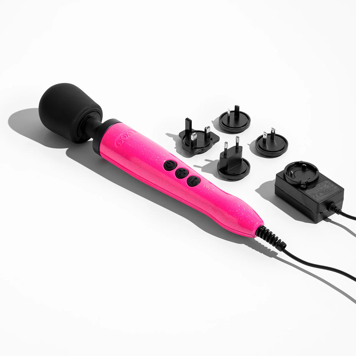 Doxy Die Cast shown next to all of its power cord accessories. It has an adapter to fit most power outlets. | Kinkly Shop