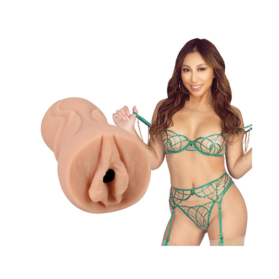 Nicole Doshi is looking into the camera while wearing lingerie. The Signature Strokers - Nicole Doshi stroker is shown next to the porn star. | Kinkly Shop