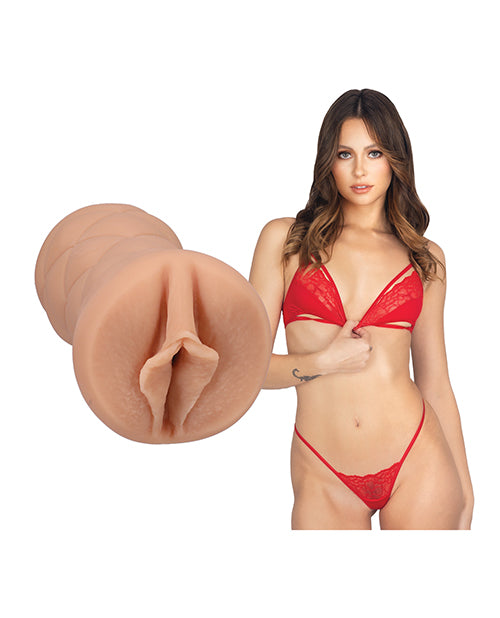 Stella Barey is staring into the camera while wearing lingerie. The Signature Strokers - Stella Barey stroker is next to the porn star. | Kinkly Shop